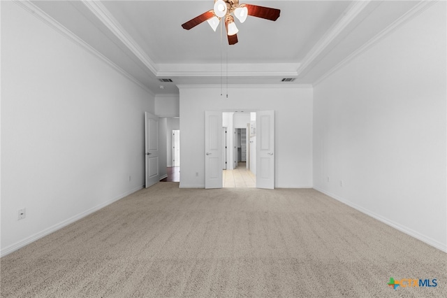 interior space featuring ceiling fan, light colored carpet, and ornamental molding