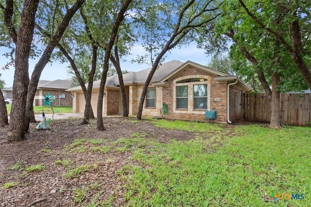 3425 Doss St, Copperas Cove, TX 76522 - single story home featuring brick siding, a garage, and driveway