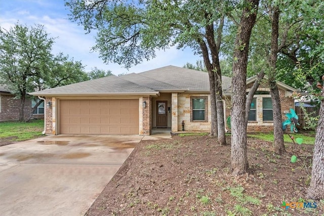 3425 Doss St, Copperas Cove, TX 76522 - ranch-style house featuring concrete driveway, an attached garage, roof with shingles, and brick siding