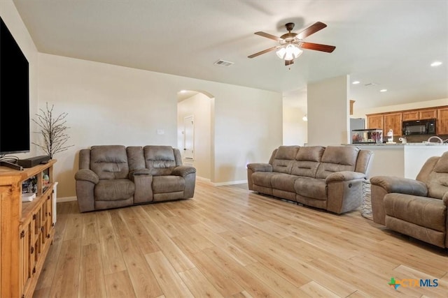 3425 Doss St, Copperas Cove, TX 76522 - living room with arched walkways, ceiling fan, light wood-type flooring, and recessed lighting