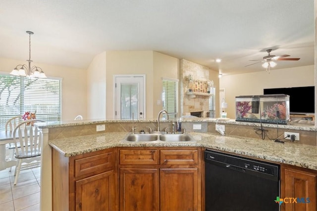 3425 Doss St, Copperas Cove, TX 76522 - kitchen featuring dishwasher, brown cabinets, a ceiling fan, light stone countertops, and open floor plan