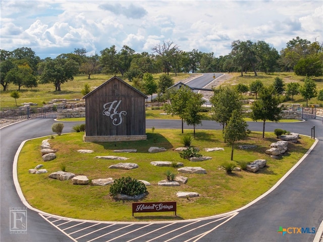 view of property's community with a yard