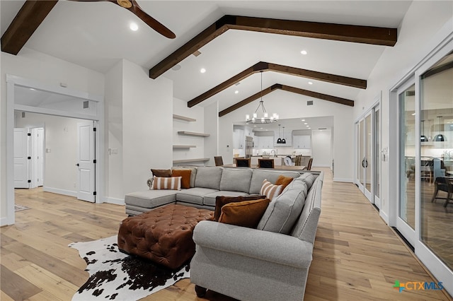 living room with lofted ceiling with beams, ceiling fan with notable chandelier, and light wood-type flooring