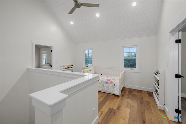 bedroom with high vaulted ceiling, light wood-type flooring, multiple windows, and ceiling fan