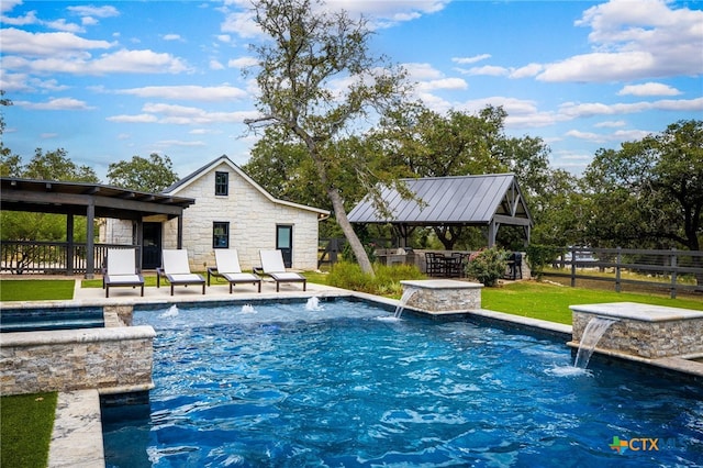 view of swimming pool featuring a patio, a lawn, and pool water feature