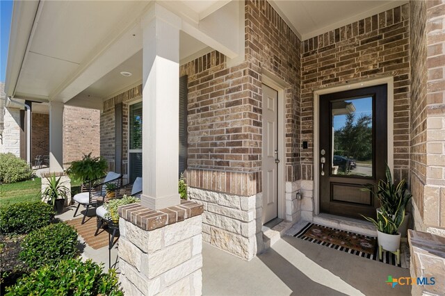 2233 Sauterne Dr, Leander, TX 78641 - property entrance with covered porch and brick siding
