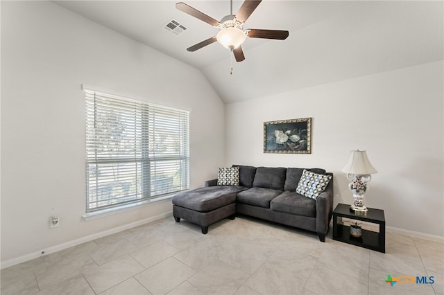 2233 Sauterne Dr, Leander, TX 78641 - living room with ceiling fan, vaulted ceiling, baseboards, and light tile patterned floors