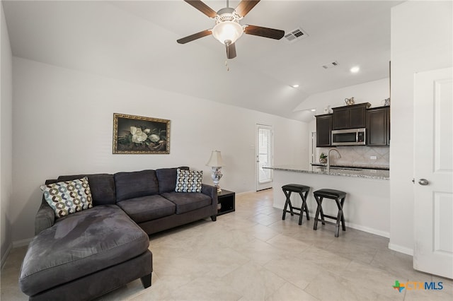 2233 Sauterne Dr, Leander, TX 78641 - living room with a ceiling fan, lofted ceiling, baseboards, and recessed lighting