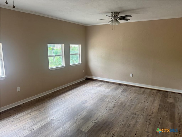 1315 S 51st St, Temple, TX 76504 - unfurnished room with a ceiling fan, crown molding, wood finished floors, and baseboards