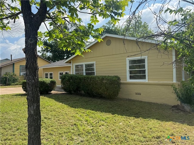 1315 S 51st St, Temple, TX 76504 - view of home's exterior with a yard and crawl space