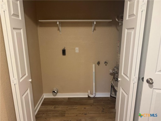 1315 S 51st St, Temple, TX 76504 - laundry area with wood finished floors, electric dryer hookup, and baseboards