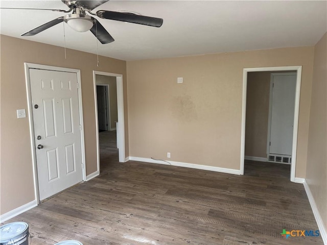 1315 S 51st St, Temple, TX 76504 - unfurnished room with a ceiling fan, wood finished floors, and baseboards