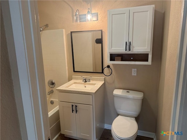 1315 S 51st St, Temple, TX 76504 - full bath featuring toilet, vanity,  shower combination, and a textured wall