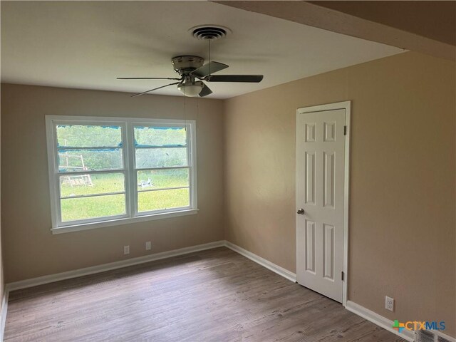 1315 S 51st St, Temple, TX 76504 - empty room featuring a ceiling fan, baseboards, and wood finished floors