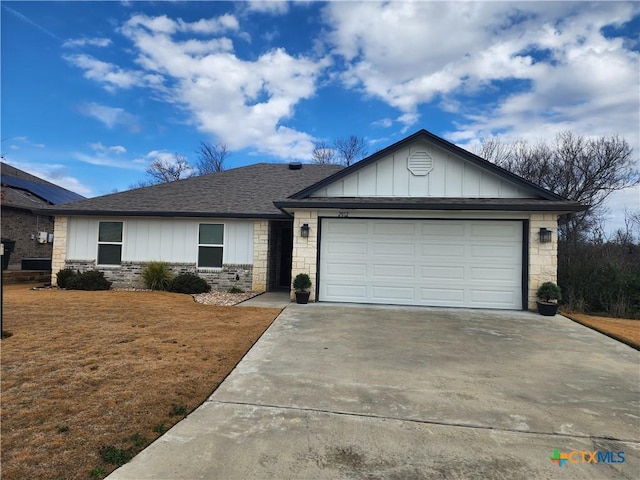 single story home with a garage and a front lawn