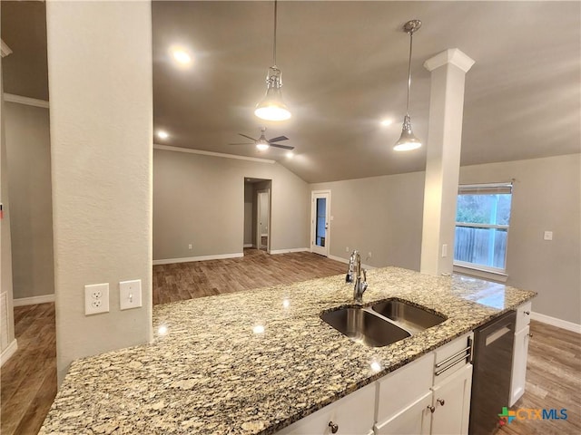 kitchen with white cabinetry, sink, light stone counters, and dishwasher