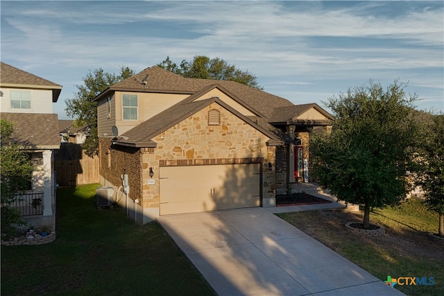 view of front facade with a garage and a front lawn