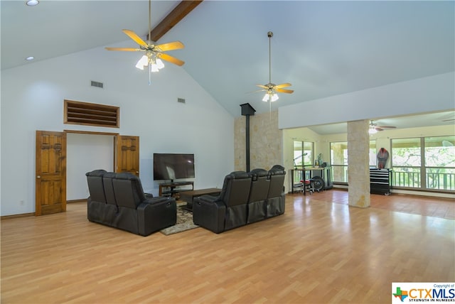 living room with high vaulted ceiling, light hardwood / wood-style floors, beamed ceiling, and ceiling fan