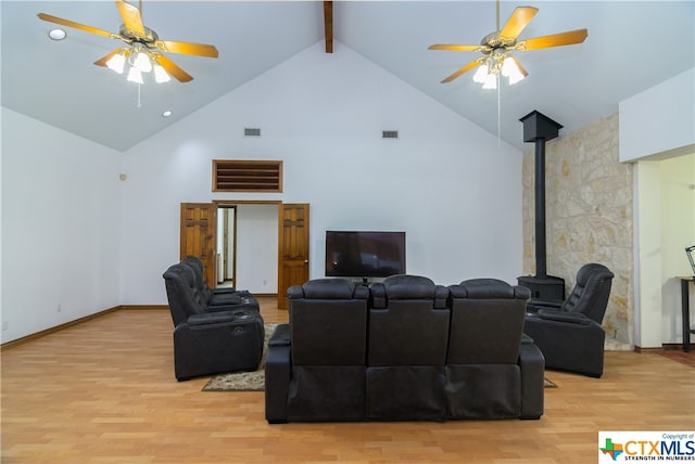 cinema featuring high vaulted ceiling, light hardwood / wood-style flooring, ceiling fan, and beam ceiling