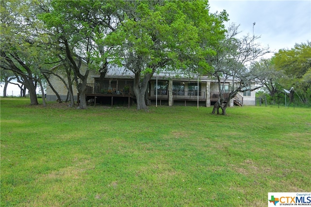 view of yard featuring a wooden deck