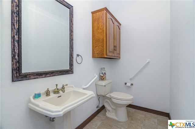 bathroom with sink and toilet