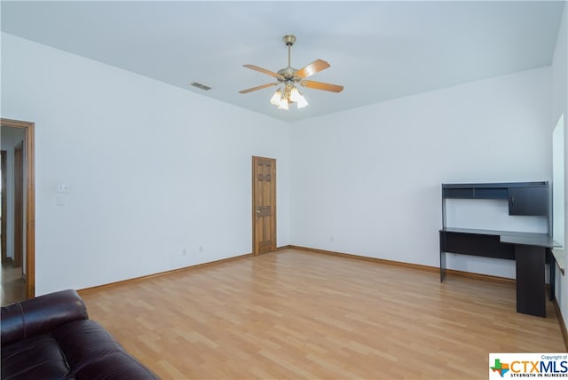 living room with hardwood / wood-style floors and ceiling fan