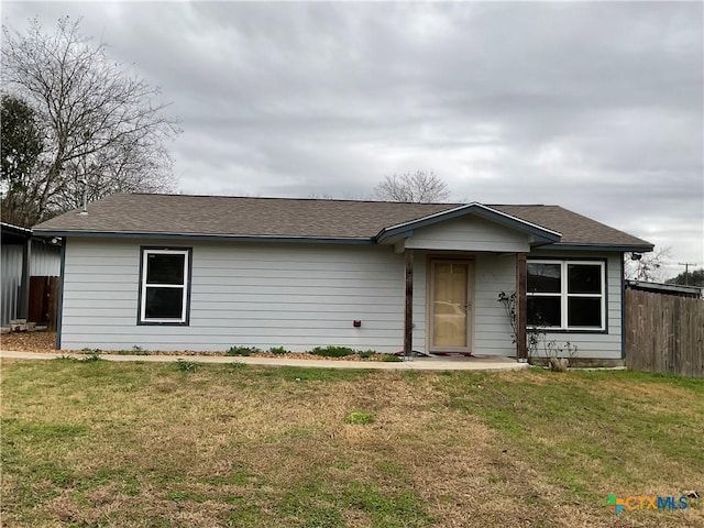 single story home featuring a front yard