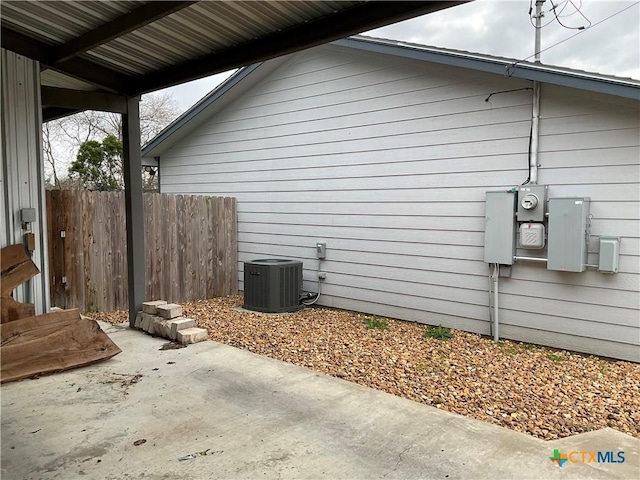 view of home's exterior featuring central AC and a patio