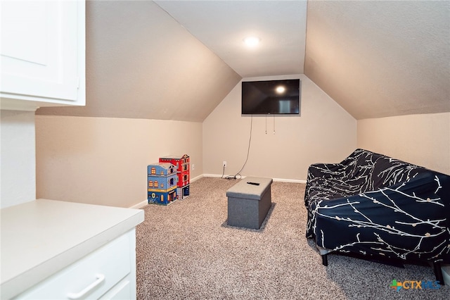 playroom with carpet flooring and lofted ceiling