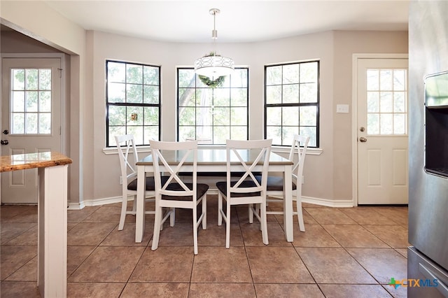 dining area featuring tile patterned flooring and a wealth of natural light