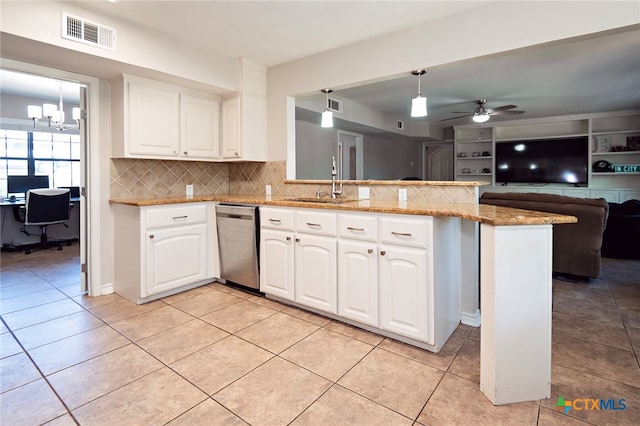 kitchen featuring kitchen peninsula, ceiling fan with notable chandelier, pendant lighting, dishwasher, and white cabinets