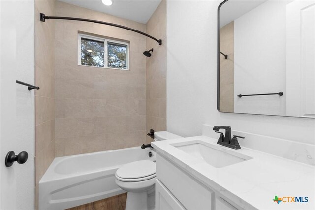4121 Turning Leaf Dr, Nolanville, TX 76559 - full bath featuring toilet, wood finished floors, vanity, and shower / bathtub combination