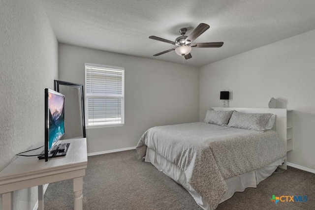 carpeted bedroom with baseboards, a ceiling fan, and a textured ceiling