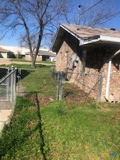 view of side of property featuring a yard