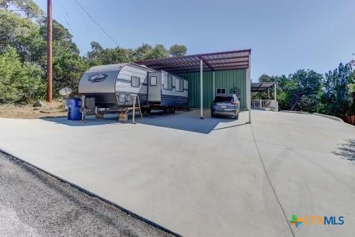 162 Canyon Crk, Canyon Lake, TX 78133 - view of parking / parking lot