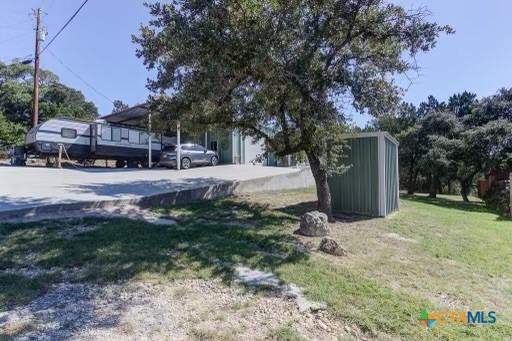 162 Canyon Crk, Canyon Lake, TX 78133 - view of yard with concrete driveway