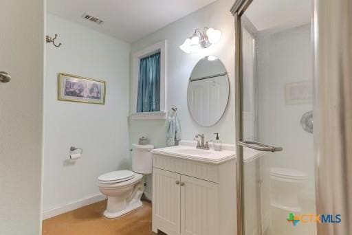162 Canyon Crk, Canyon Lake, TX 78133 - bathroom featuring baseboards, visible vents, toilet, and vanity