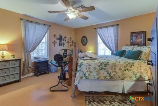 162 Canyon Crk, Canyon Lake, TX 78133 - carpeted bedroom featuring visible vents and a ceiling fan