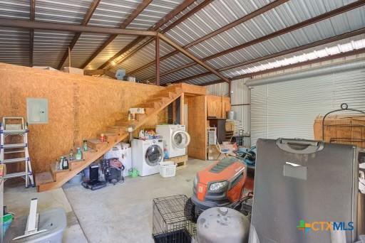 162 Canyon Crk, Canyon Lake, TX 78133 - garage featuring metal wall and washer / clothes dryer