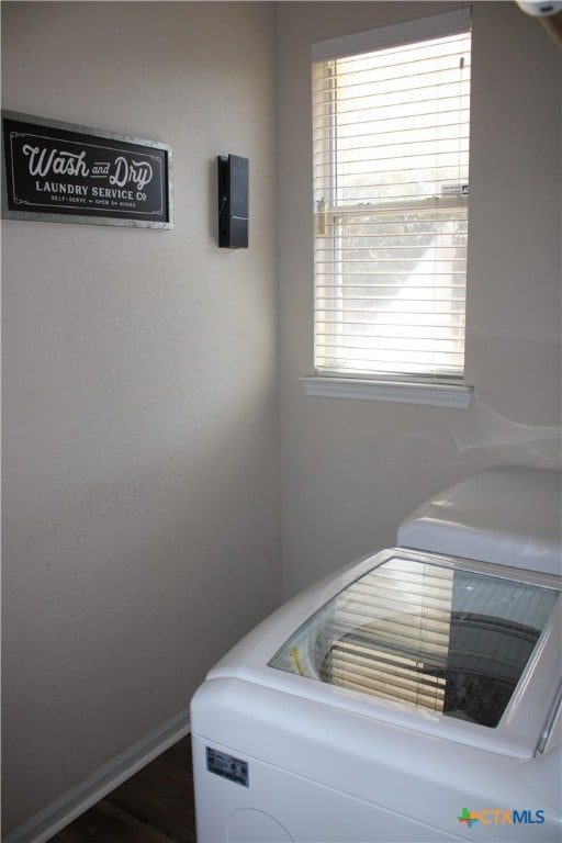 laundry area featuring dark hardwood / wood-style flooring and independent washer and dryer