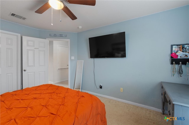 bedroom with light carpet and ceiling fan