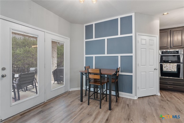 dining space featuring light hardwood / wood-style flooring