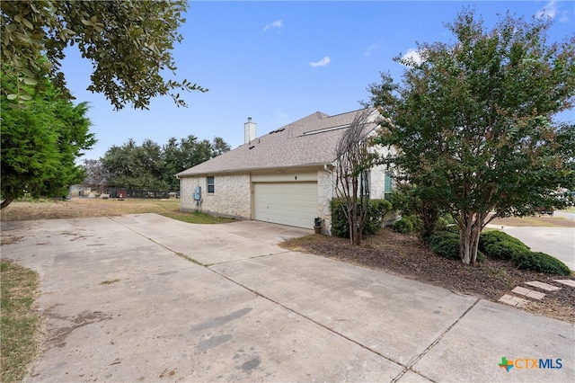 view of side of property with a garage