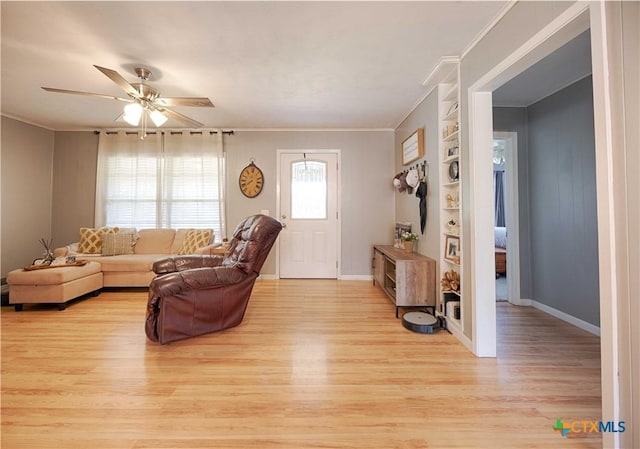 207 River St, Hallettsville, TX 77964 - living room with ornamental molding, light wood-style floors, a ceiling fan, and baseboards