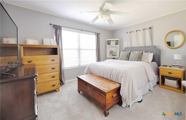 207 River St, Hallettsville, TX 77964 - bedroom featuring light colored carpet, ornamental molding, and a ceiling fan