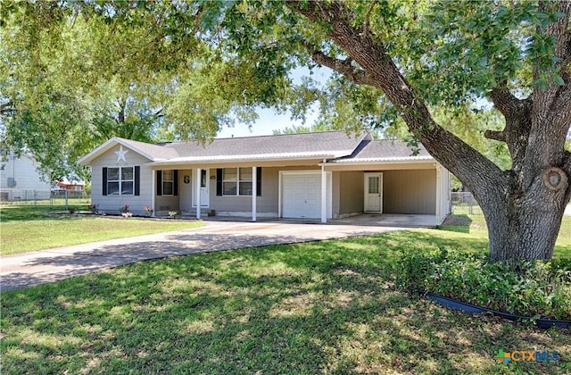 207 River St, Hallettsville, TX 77964 - ranch-style house featuring concrete driveway, a garage, and an attached carport