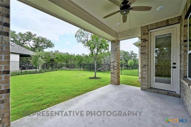 view of patio / terrace with a fenced backyard and a ceiling fan