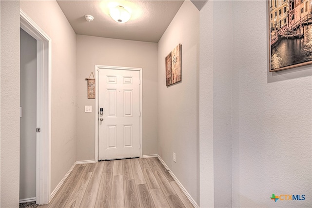 doorway featuring light hardwood / wood-style flooring