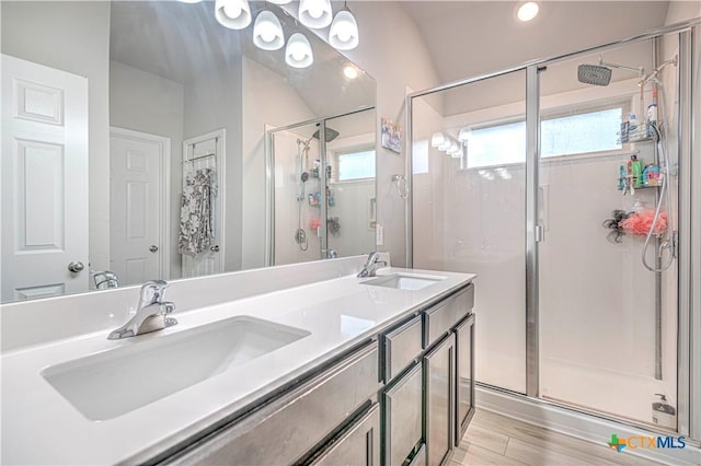 3154 Wigeon Way, Copperas Cove, TX 76522 - bathroom featuring a stall shower, double vanity, healthy amount of natural light, recessed lighting, and wood finished floors
