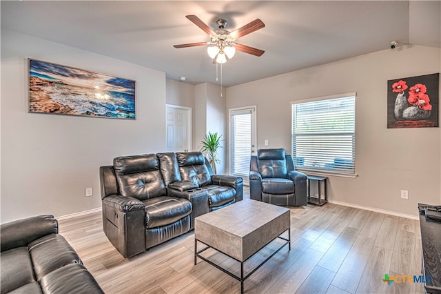 living room with ceiling fan and light wood-type flooring